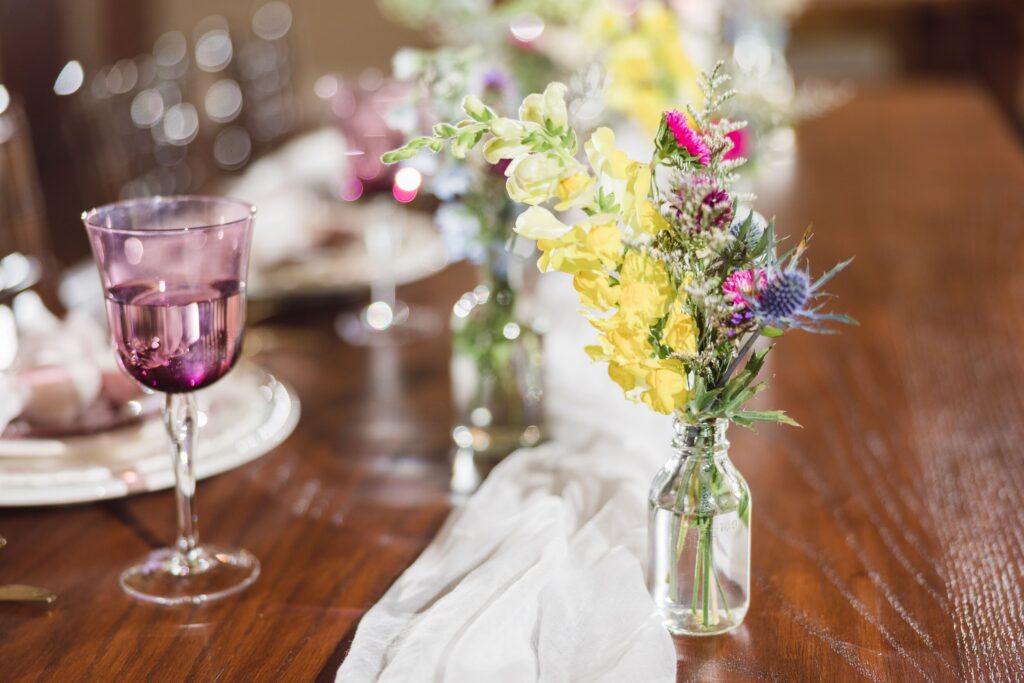 Kansas wildflowers in bud vases on wedding guest table