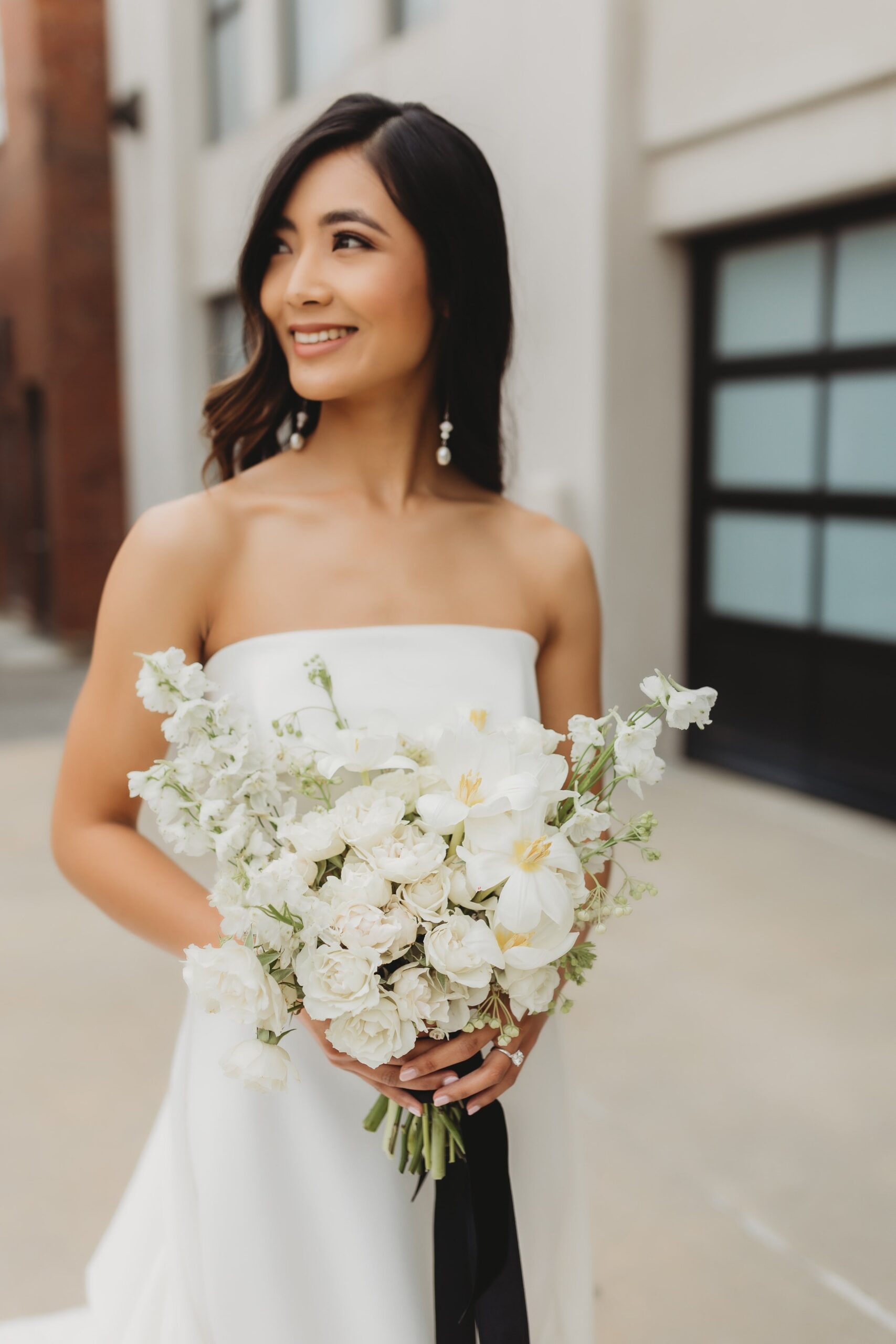 all white bridal bouquet at Outreach Event Space wedding