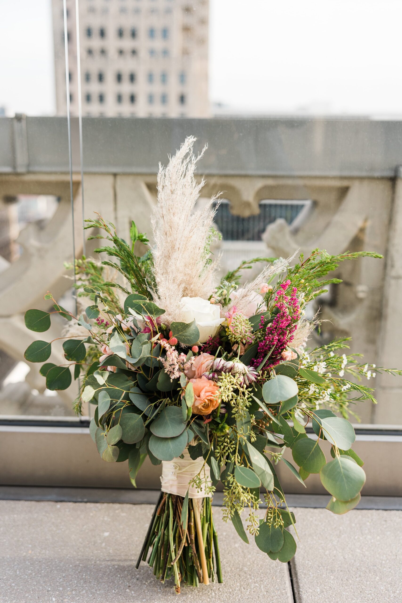Colorful boho bridal bouquet on the Starlight Terrace at Hotel Kansas City