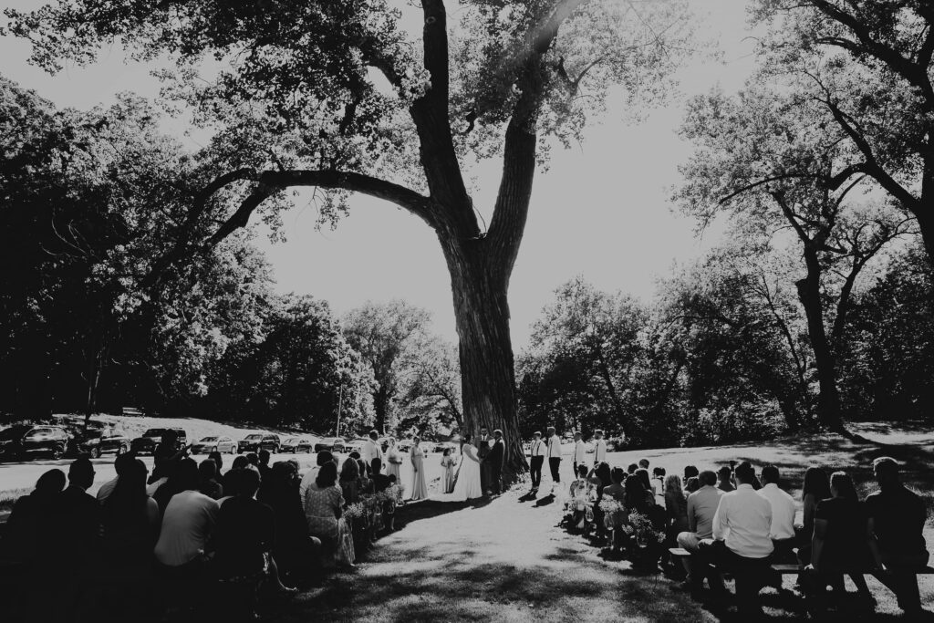 Black & white photo of a simple and intimate wedding ceremony at Roanoke Park in Kansas City