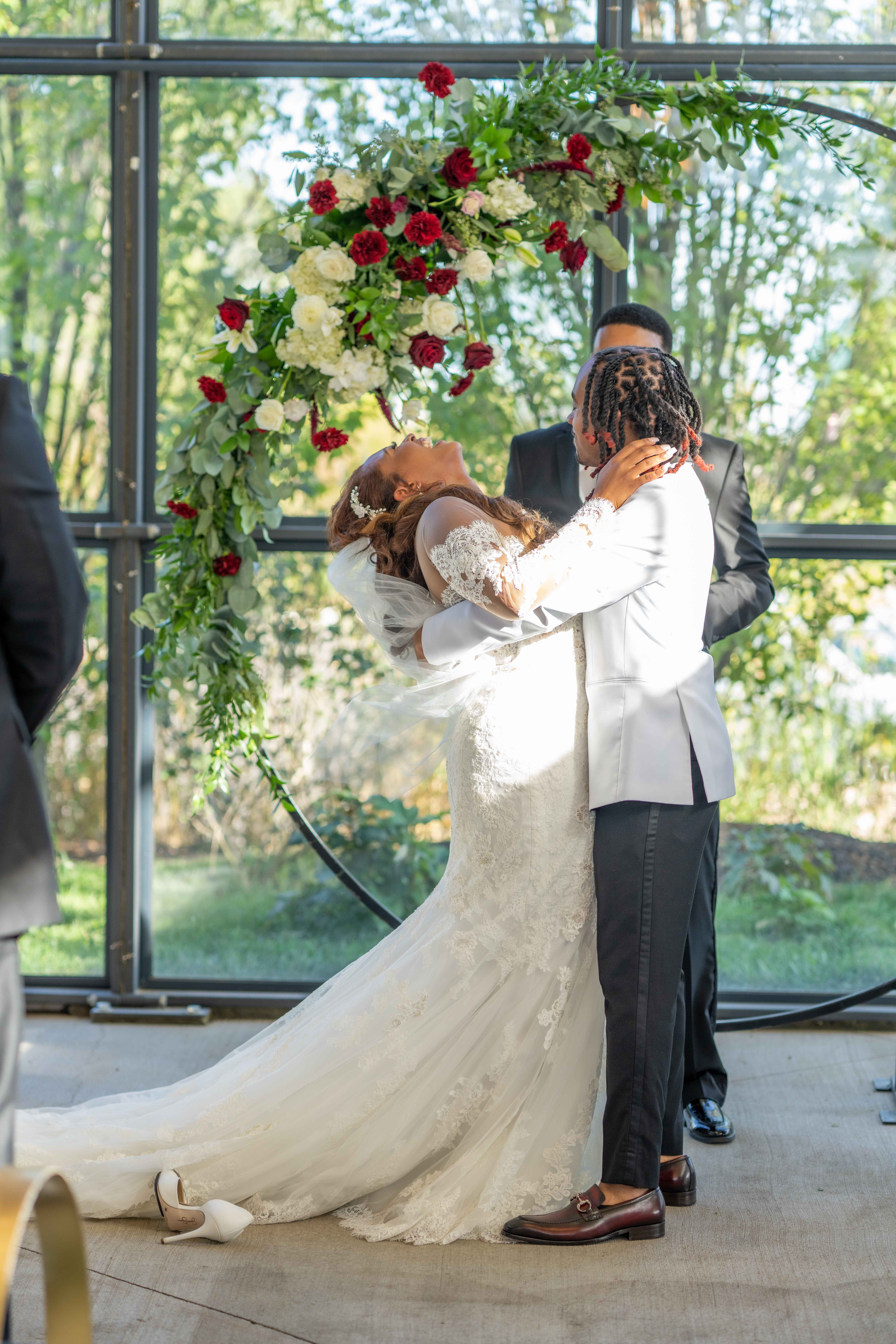 bride and groom before their first kiss at Avent Orangery, a luxury greenhouse wedding venue in Kansas City