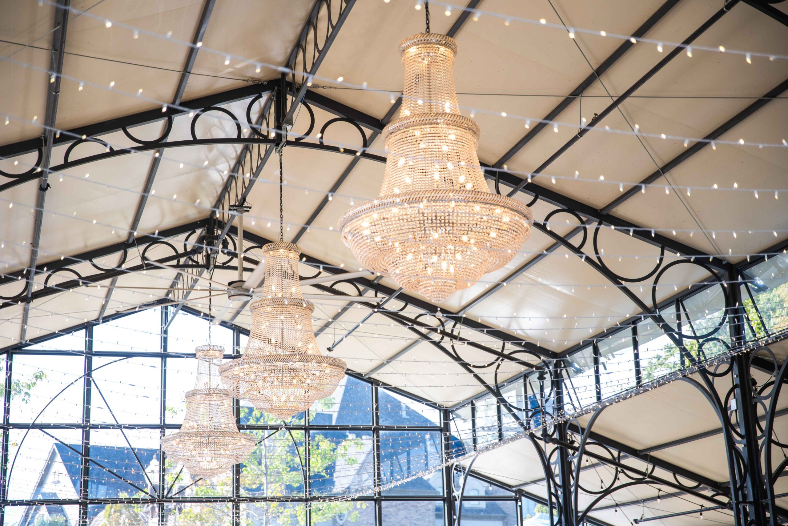 Chandeliers and lights hanging at Avent Orangery, a greenhouse wedding venue in Kansas City
