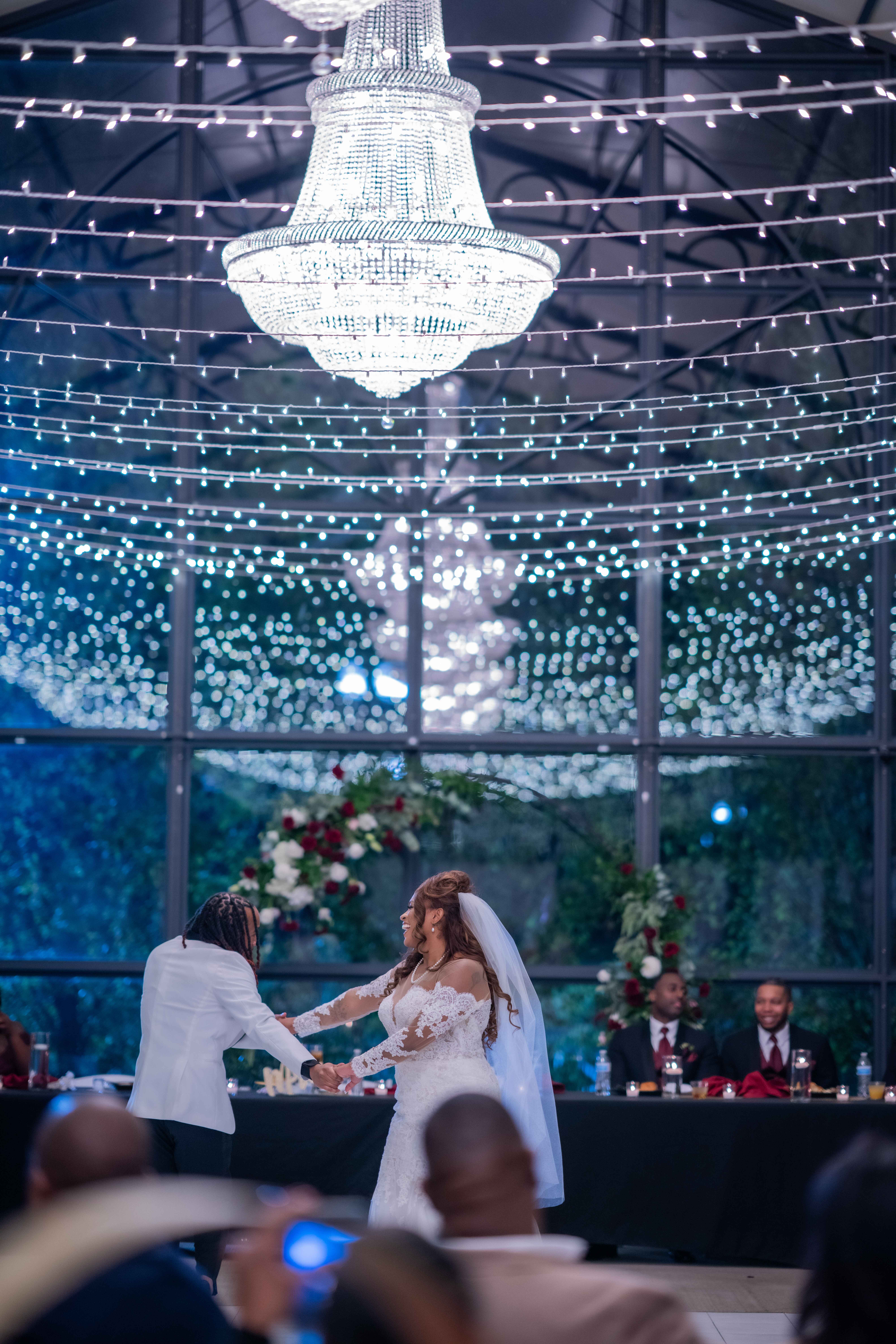 bride and grooms first dance in their greenhouse wedding venue in Kansas City