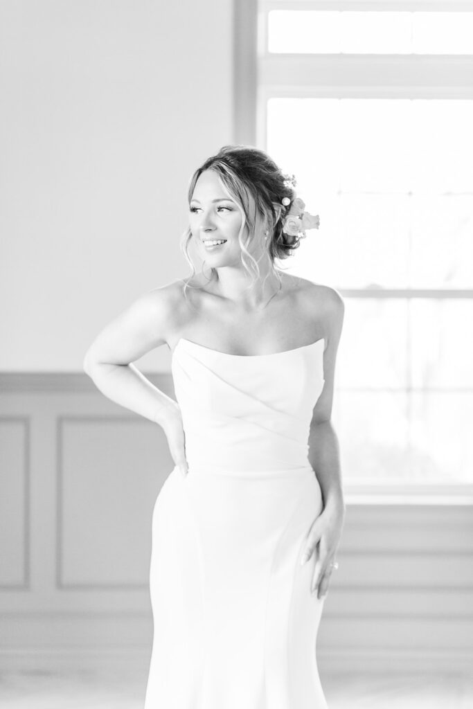 black and white portrait of a bride smiling at 1890 event space in Kansas City