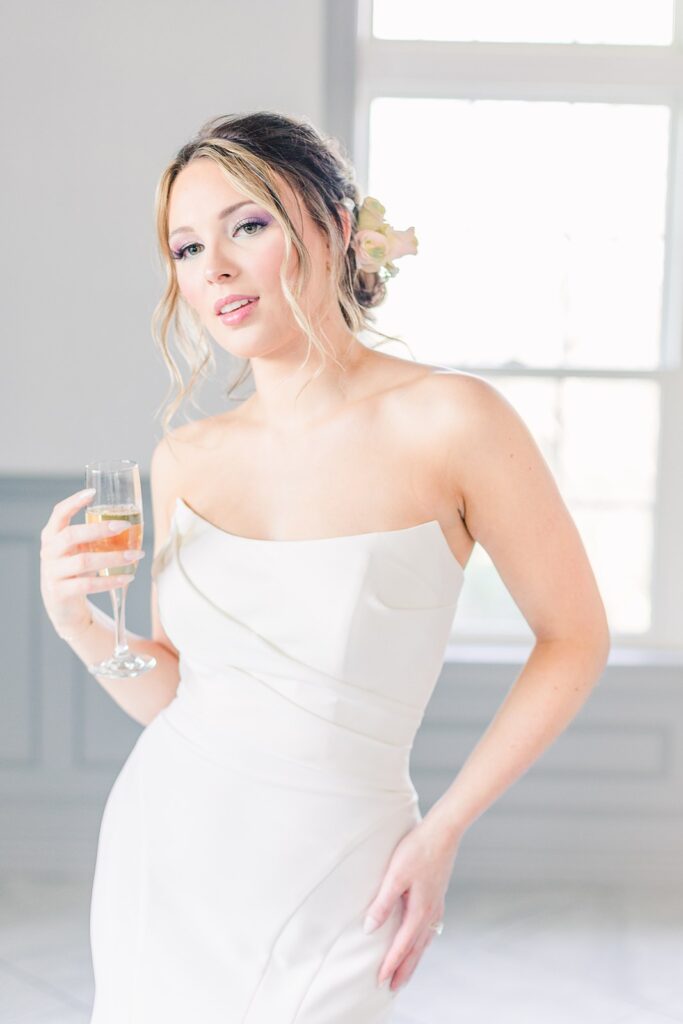 bride with champagne at 1890 event space