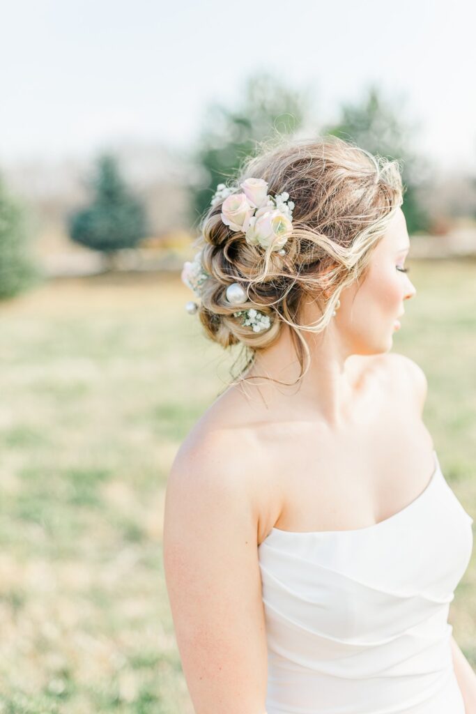 romantic wedding updo with pearls and baby's breath