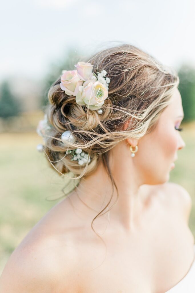 romantic wedding updo with pearls and baby's breath