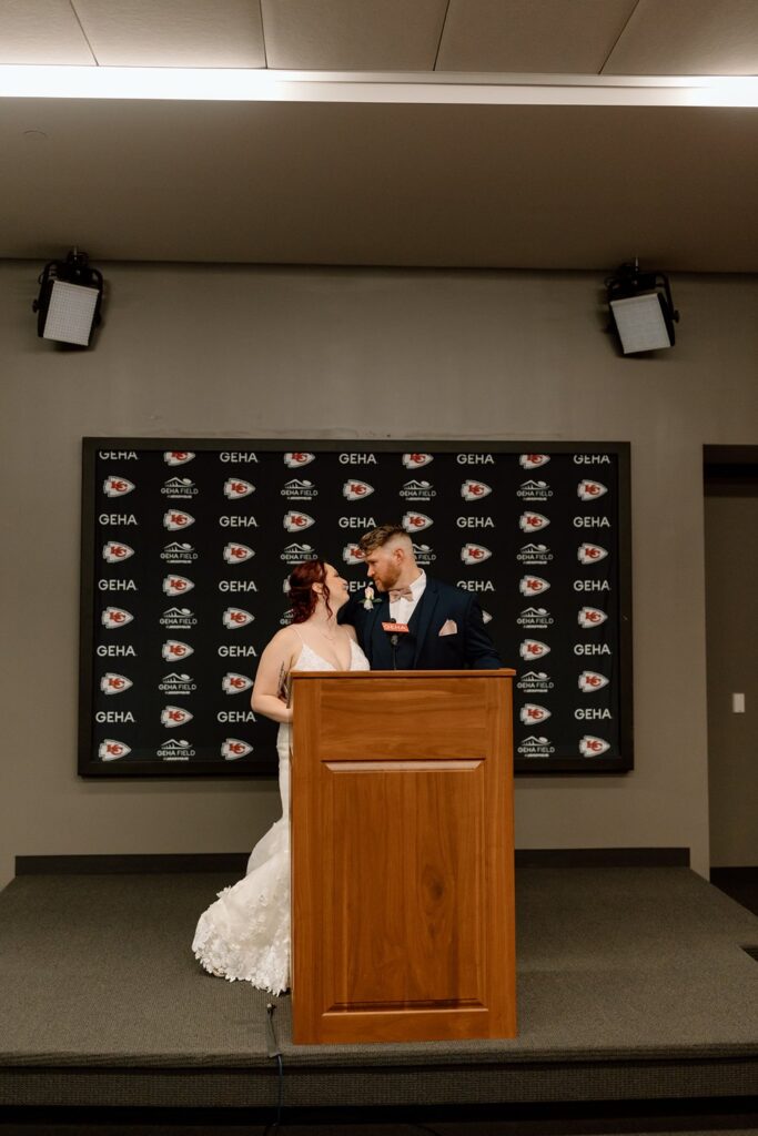 bride & groom in the press room at arrowhead