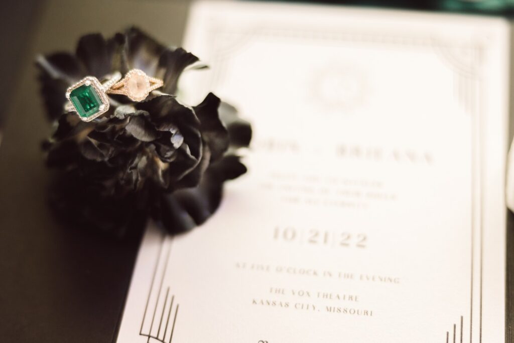 black and white, witchy wedding invitation with emerald and pink rings