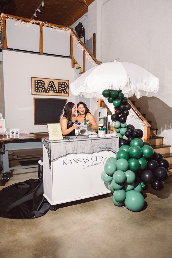 brides behind kc cocktail company bar