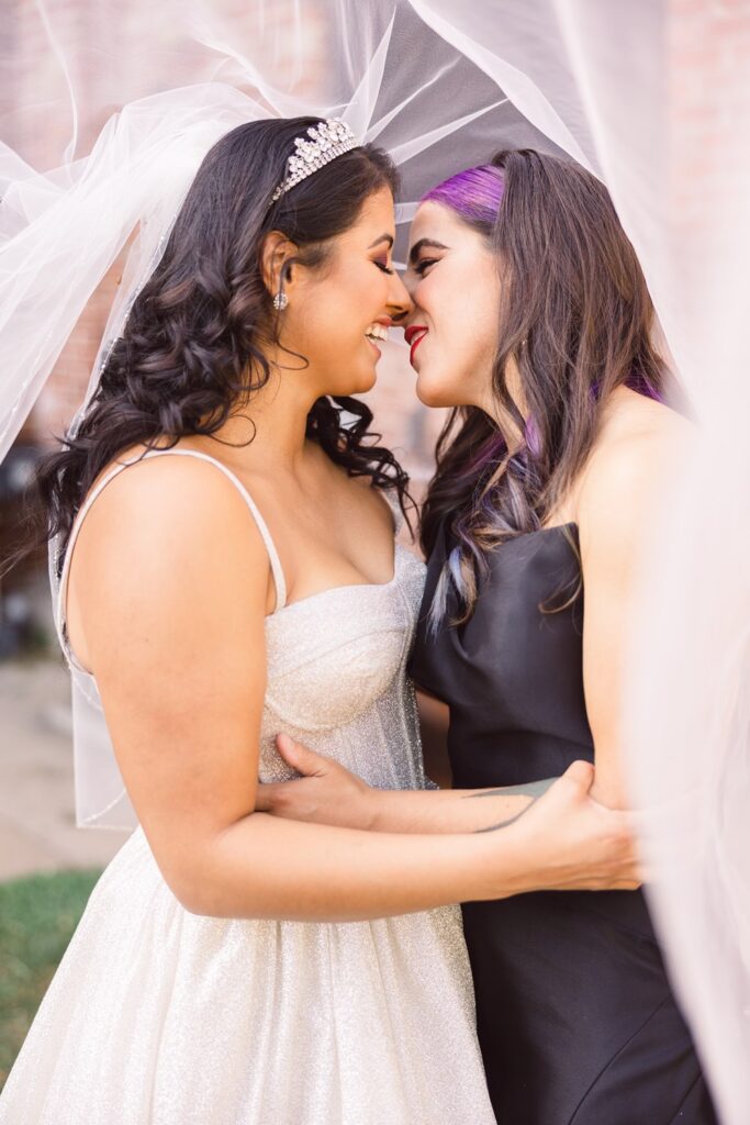 veil photo with two brides- one in white and one in black