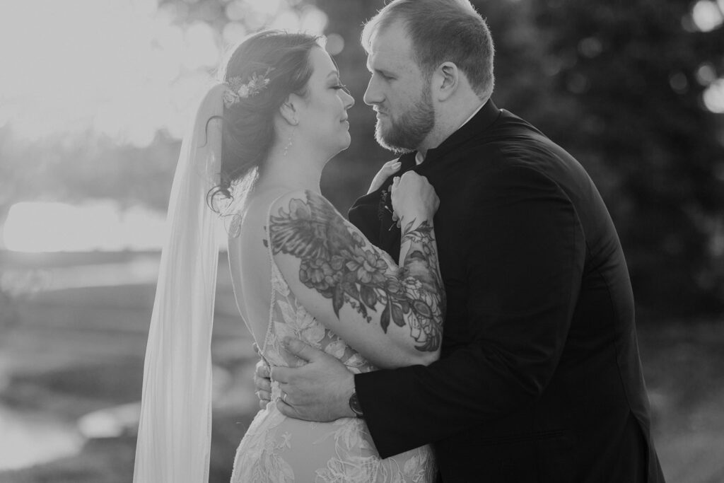dreamy black and white sunset photo of bride and groom
