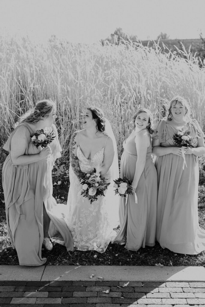 bridesmaids laughing at Thompson Barn