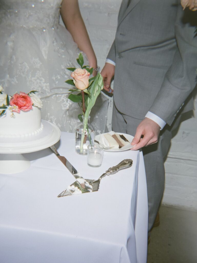 film photography wedding cake cutting at Kansas City brunch wedding