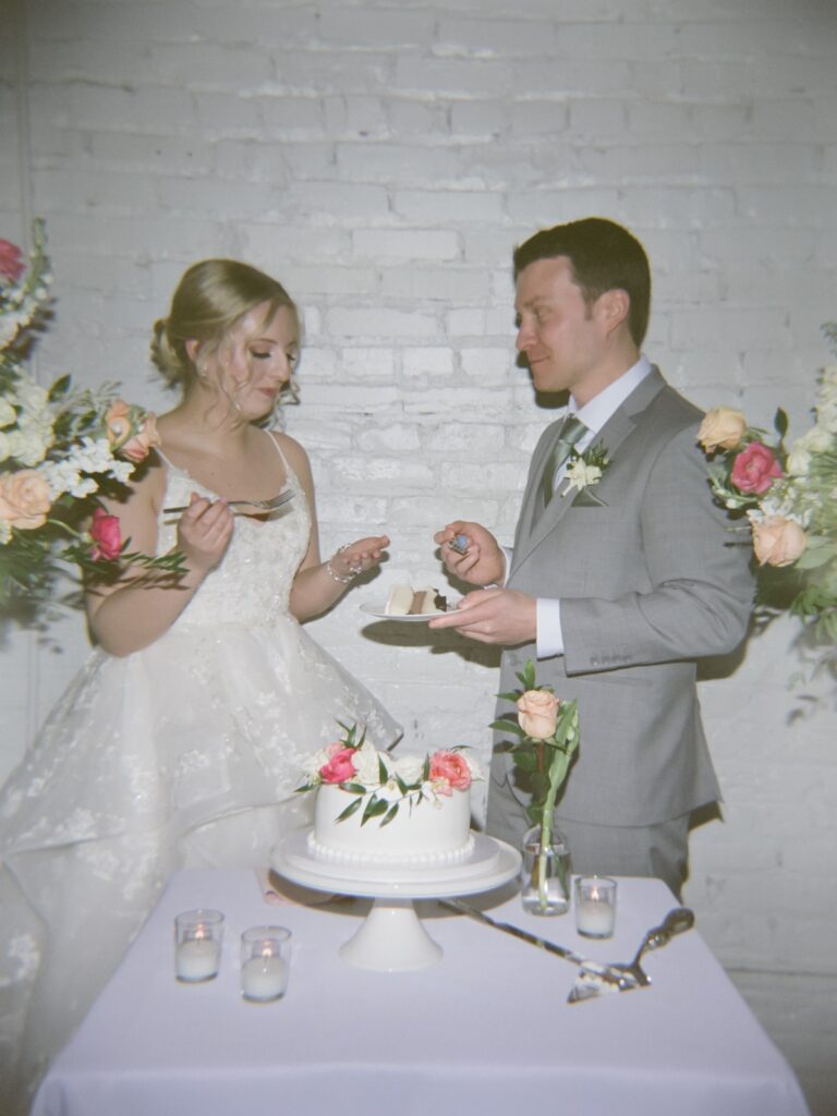 film photography wedding cake cutting at Kansas City brunch wedding