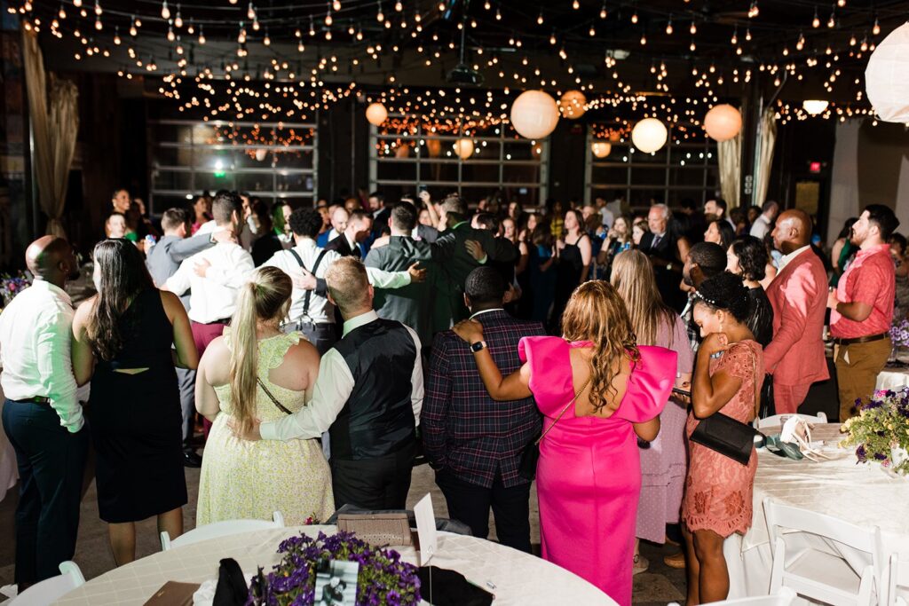 packed dance floor at 28 Event Space Kansas City Room wedding reception