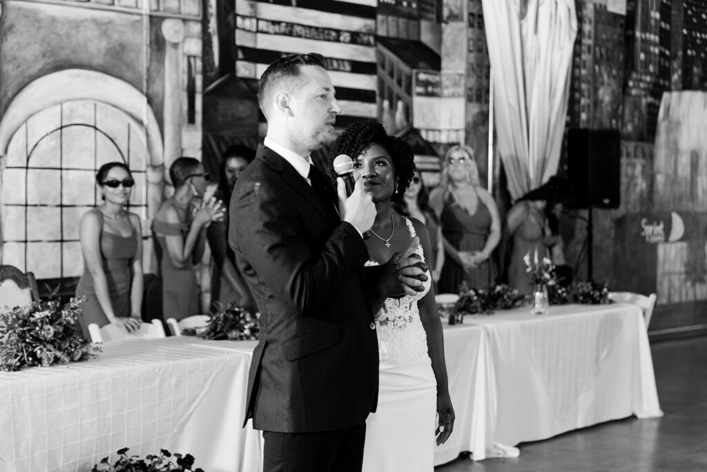newlyweds thanks their guests at 28 Event Space Kansas City Room wedding reception