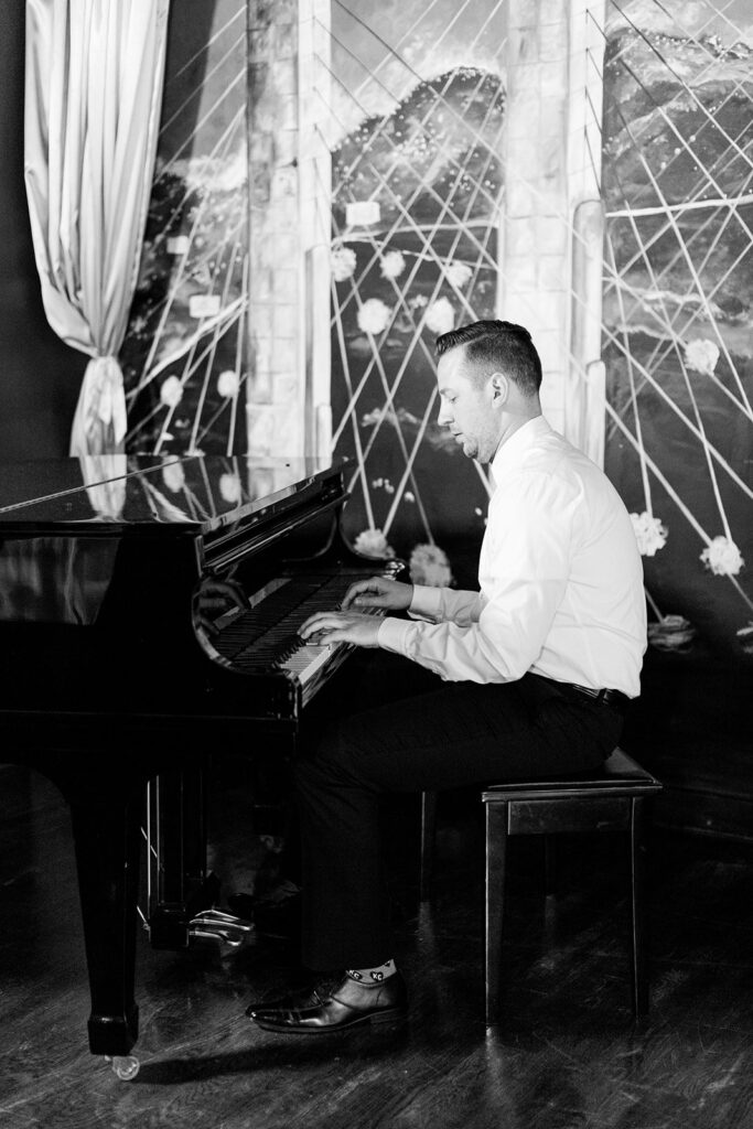 groom playing piano at 28 Event Space Kansas City Room