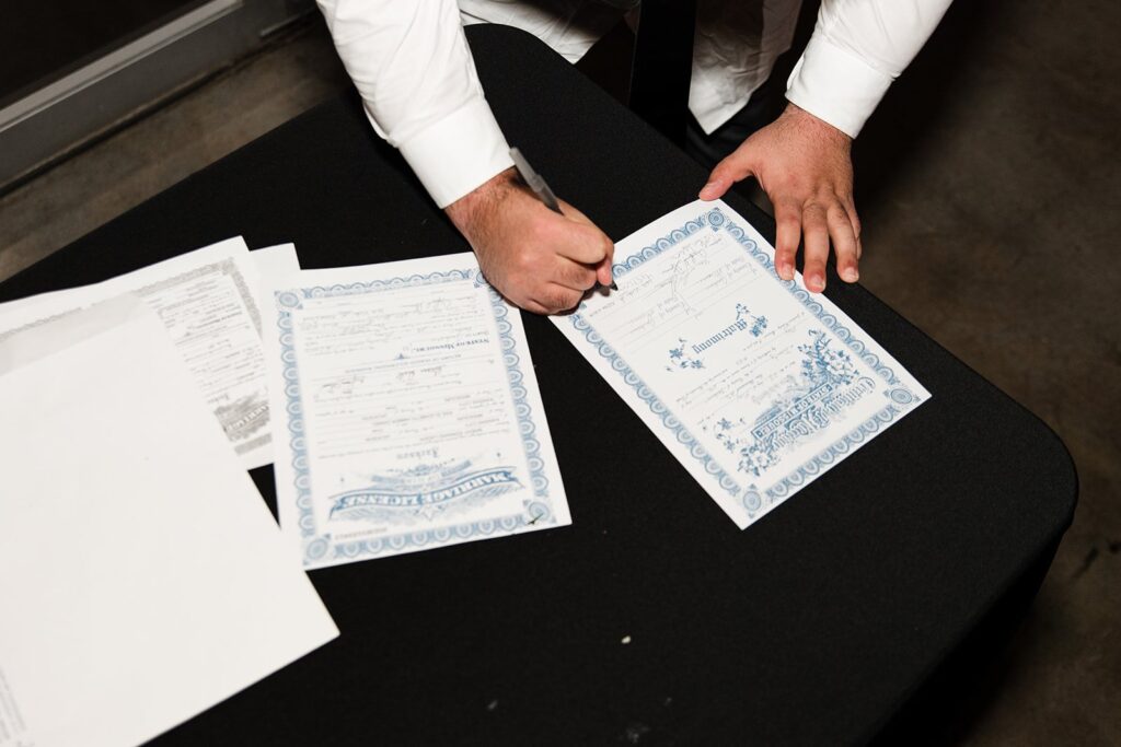 signing the marriage license at 28 Event Space Kansas City Room