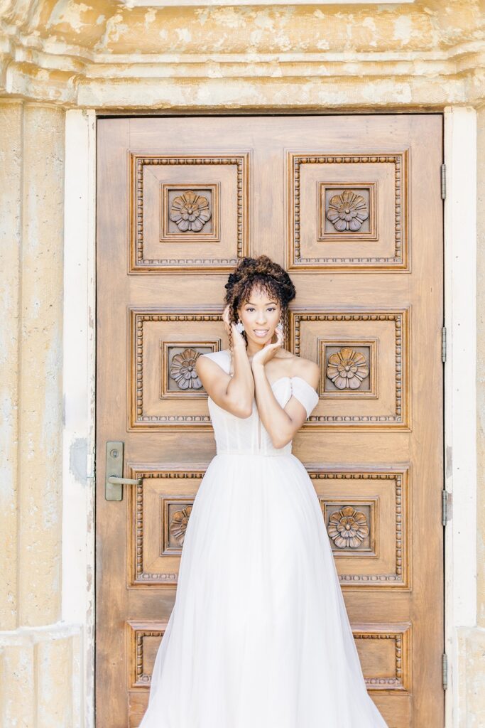 bride in front of the iconic Unity door at Unity Village