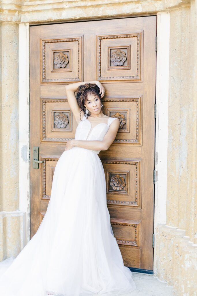 bride in front of the iconic Unity door at Unity Village