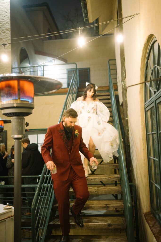 bride and groom on the la villa patio stairs