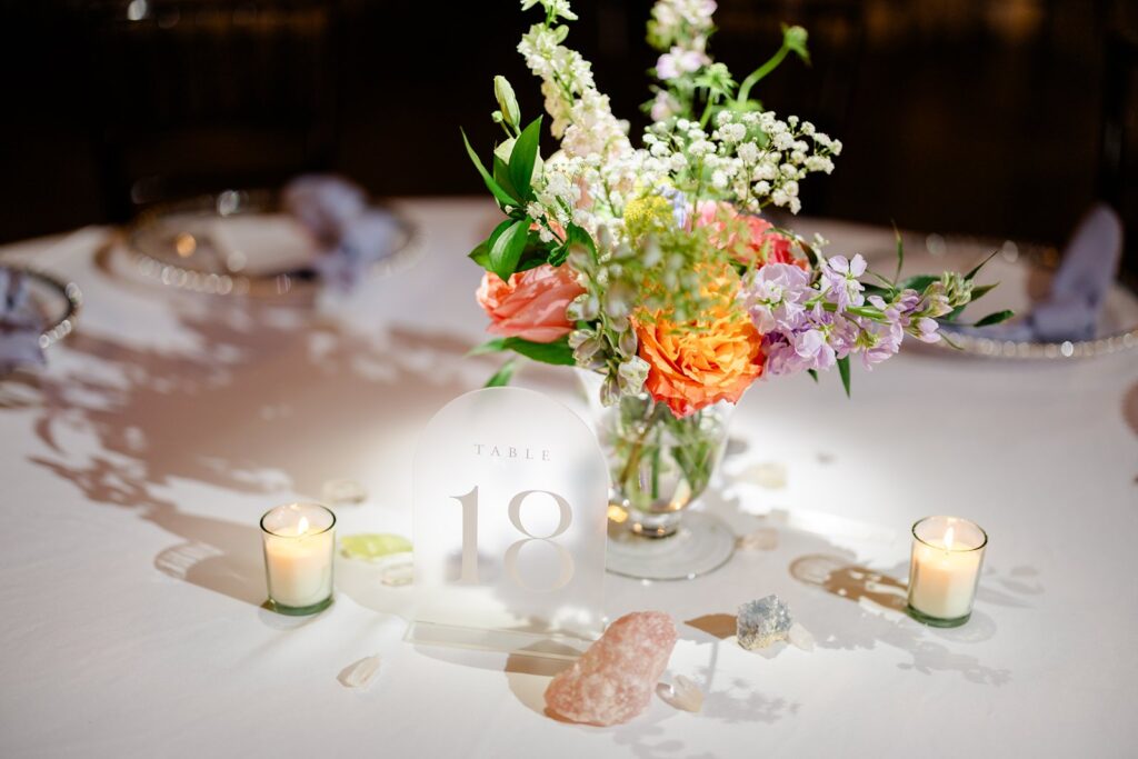 colorful centerpiece at pavilion event space wedding