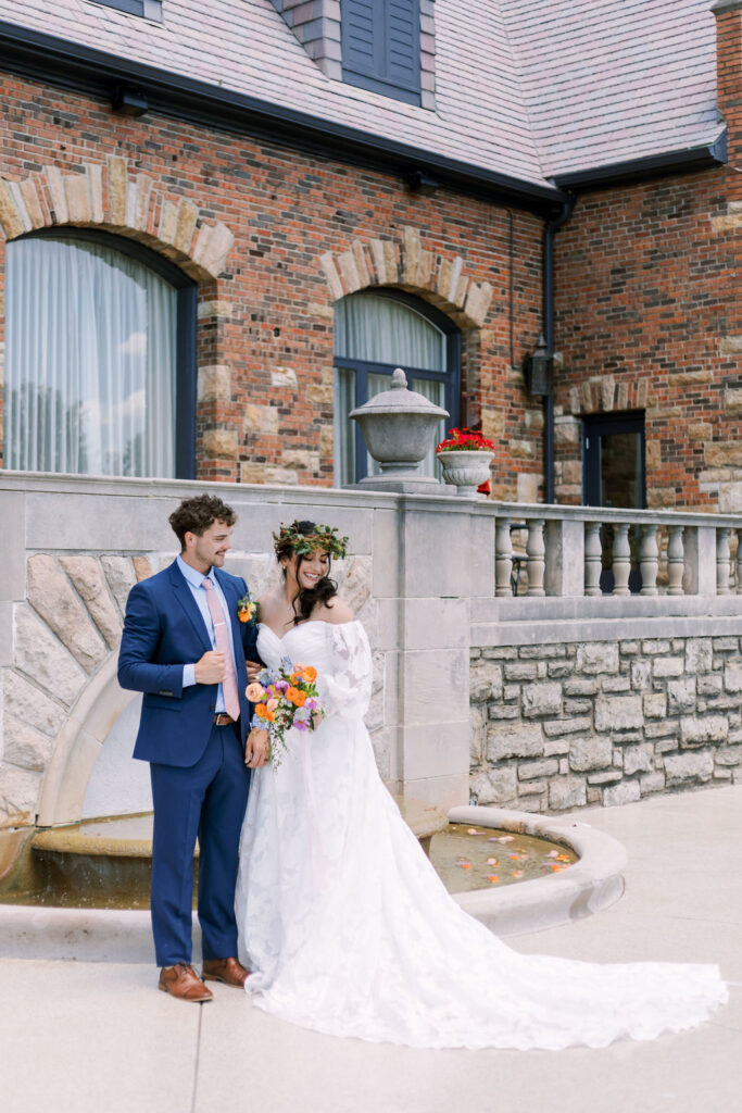 couple outside at Oakwood Country Club fountain