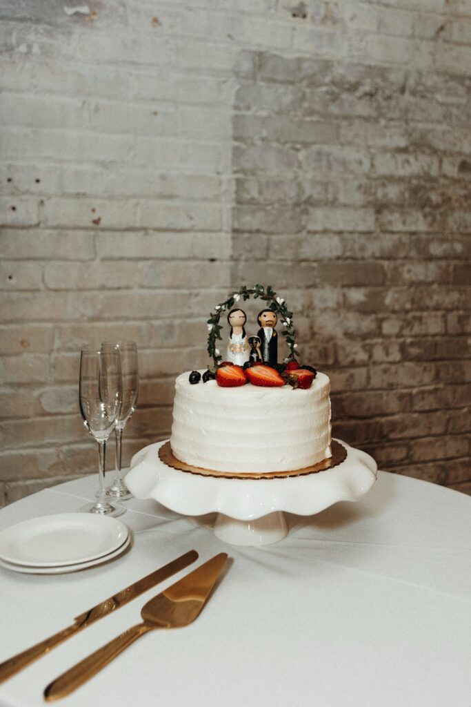 simple wedding cake with custom wooden toppers