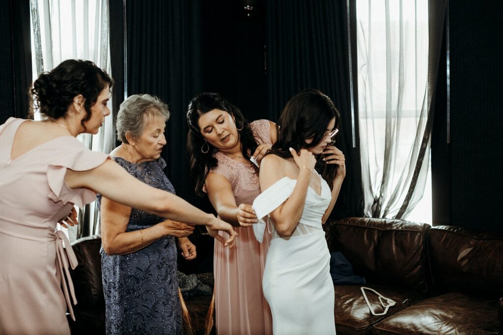 bride getting into grown at Crossroads Hotel