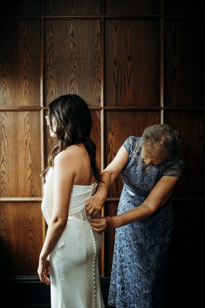 bride getting into grown at Crossroads Hotel