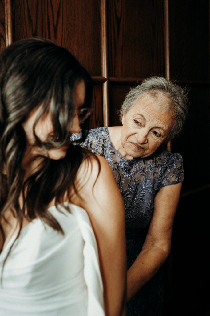 bride getting into grown at Crossroads Hotel