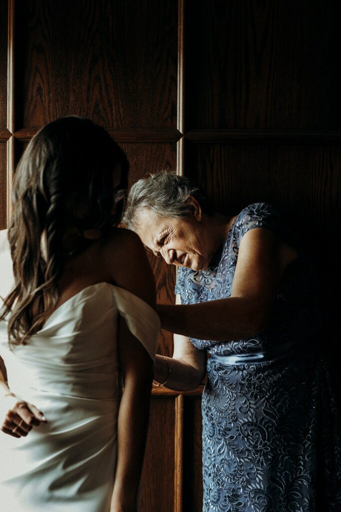 bride getting into grown at Crossroads Hotel