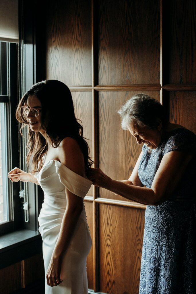 bride getting into grown at Crossroads Hotel