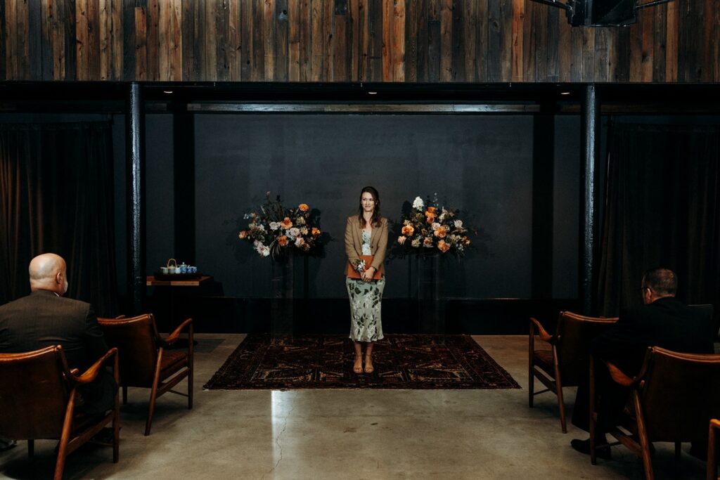 officiant at wedding ceremony at Crossroads Hotel, atrium