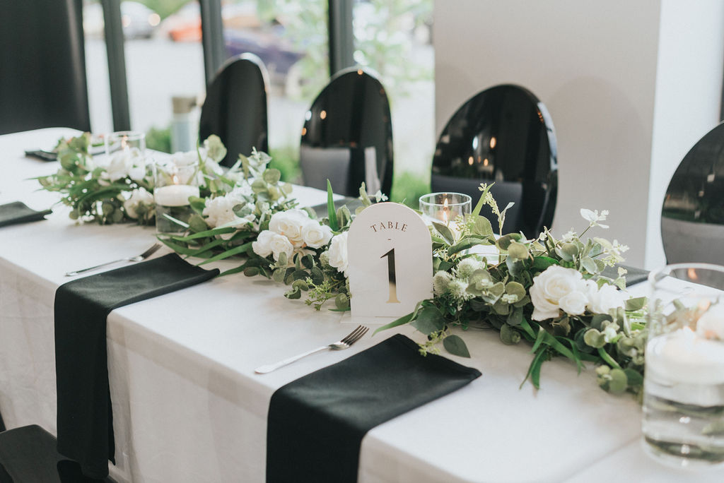 modern Kansas City wedding reception head table at The Maverick