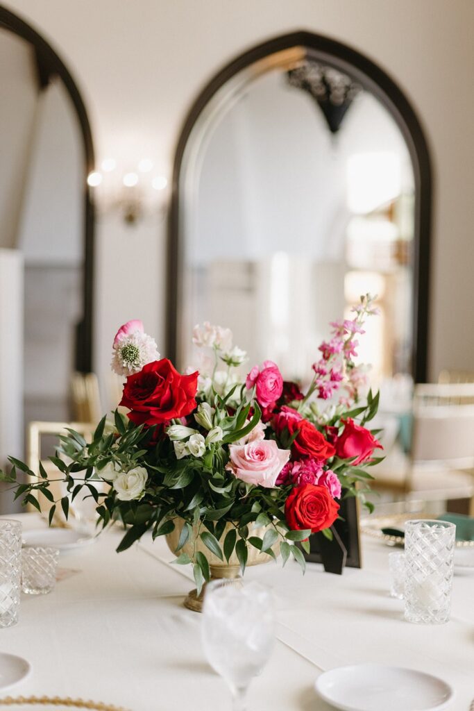 pink and red centerpiece at Oakwood Country Club wedding reception