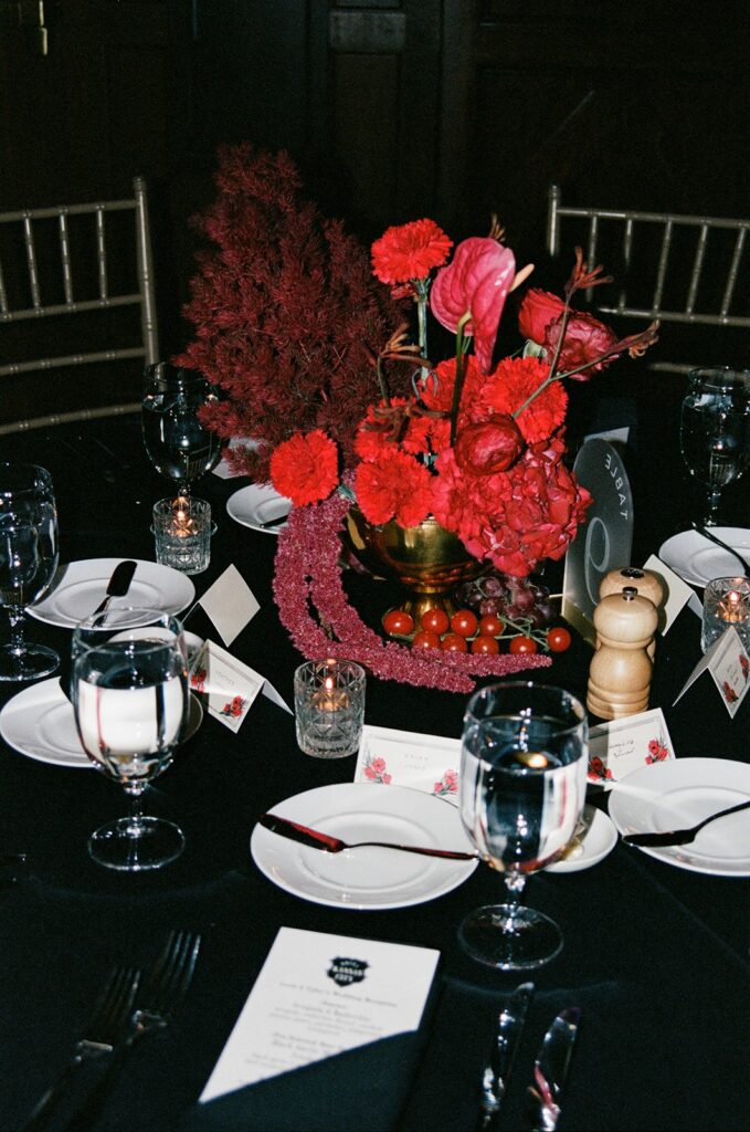 Hotel Kansas City wedding reception - all-red floral and fruit centerpieces