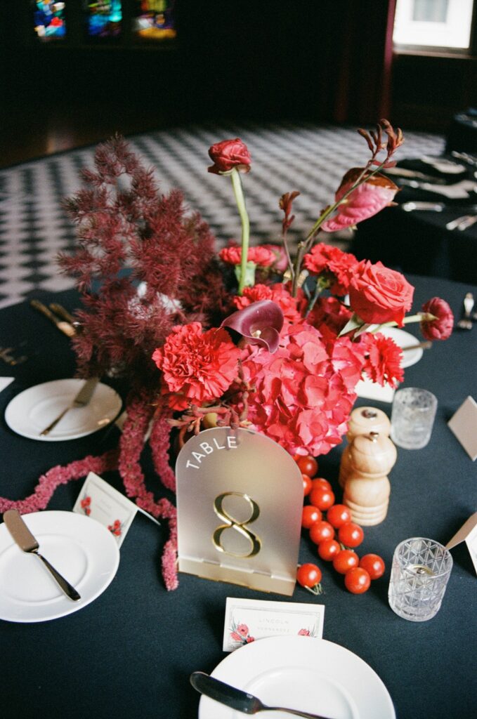 red wedding centerpieces at  Hotel Kansas City's Tudor Ballroom