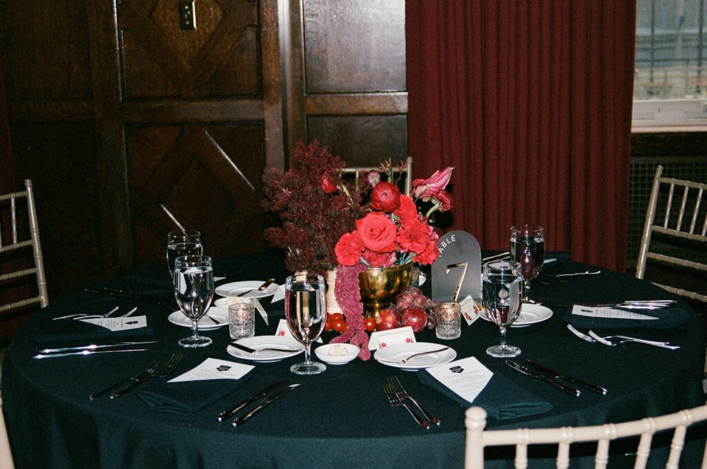 red wedding centerpieces at  Hotel Kansas City's Tudor Ballroom