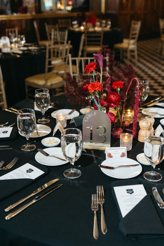 Hotel Kansas City wedding reception - all-red floral and fruit centerpieces