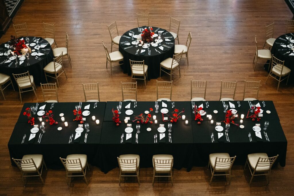 Hotel Kansas City wedding reception - all-red floral and fruit centerpieces