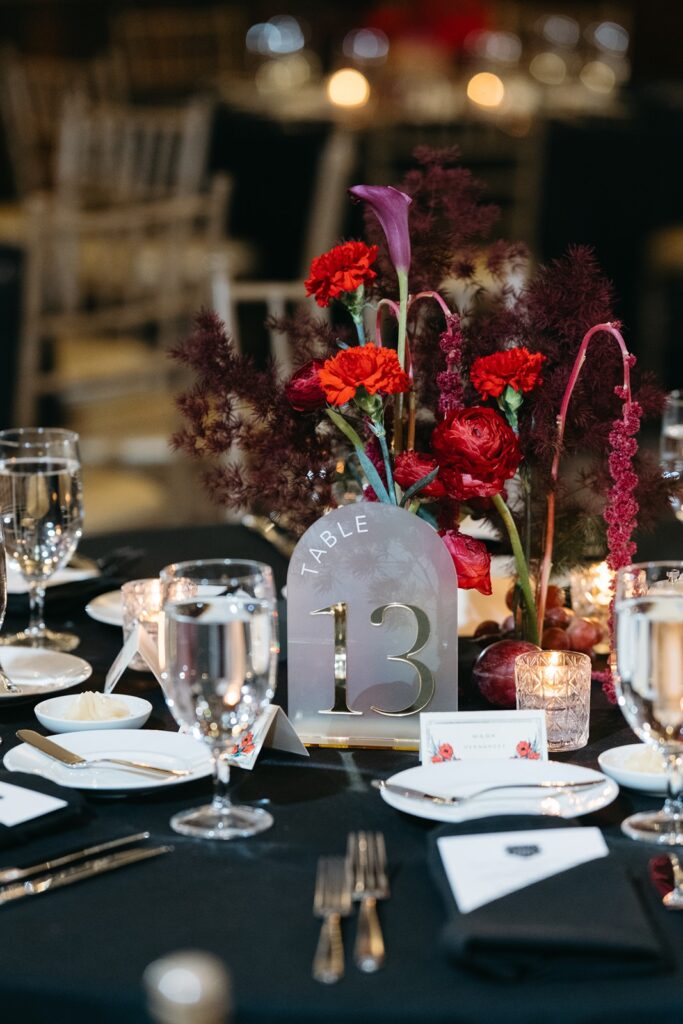 Hotel Kansas City wedding reception - all-red floral and fruit centerpieces