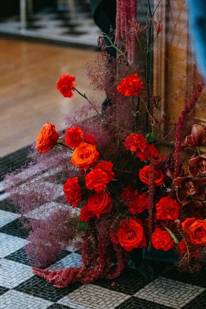 all red floral arrangement wedding reception bar Hotel Kansas City's Tudor Ballroom