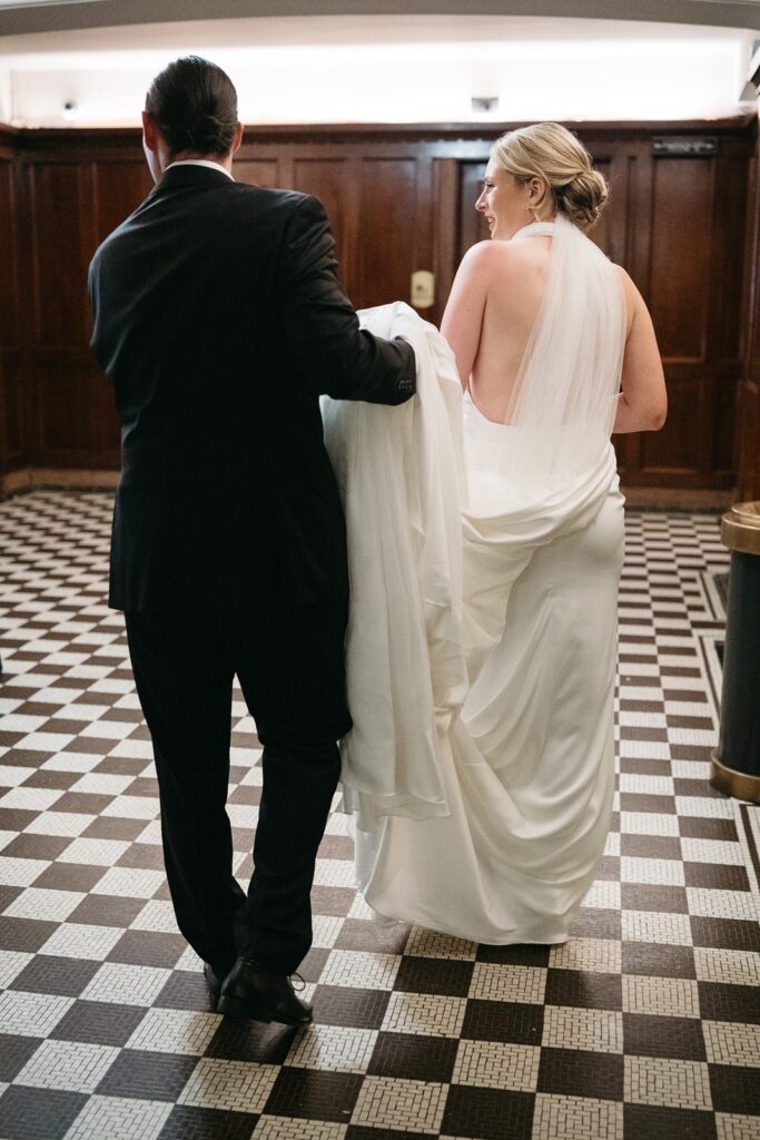 bride and groom exiting ceremony at hotel kansas city wedding