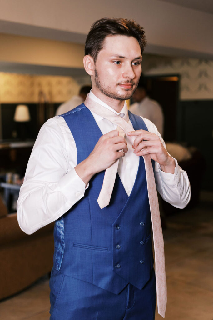 groom getting ready at countryside chalet