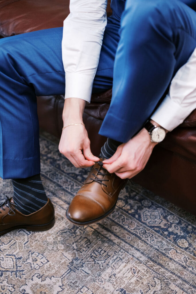 groom getting ready at countryside chalet