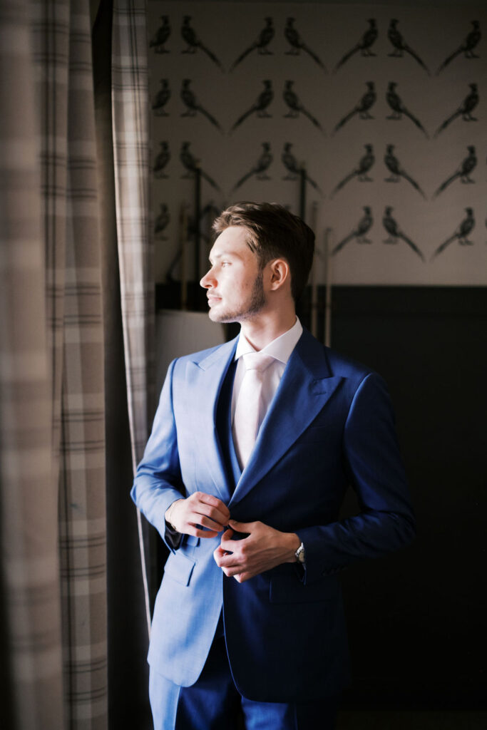 groom getting ready at countryside chalet