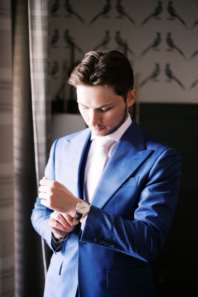 groom getting ready at countryside chalet