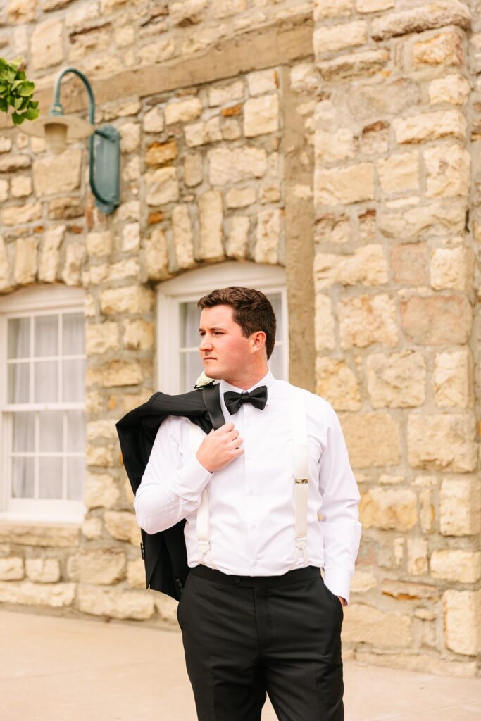grooms portraits outside of Stone Manor